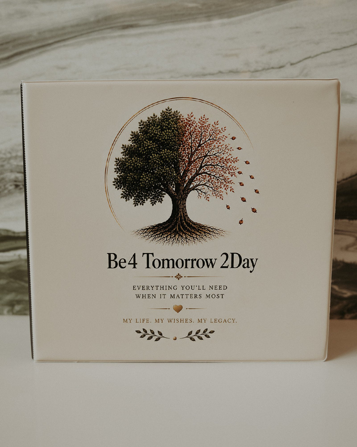 The Be4 Tomorrow 2Day Legacy Binder, front cover on a marble counter